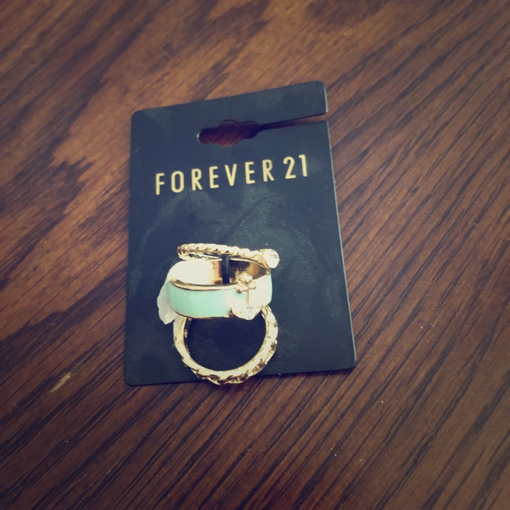 Set of 3 gold rings. Braided, teal, and diamond
